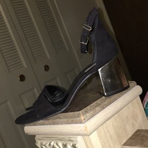 black and gold heels with a small heel